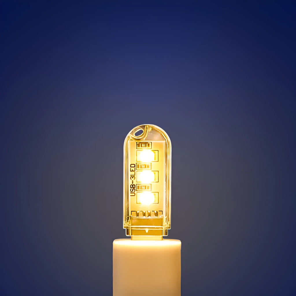Small white USB-powered LED night light showing warm and cool white light options