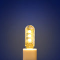 Small white USB-powered LED night light showing warm and cool white light options