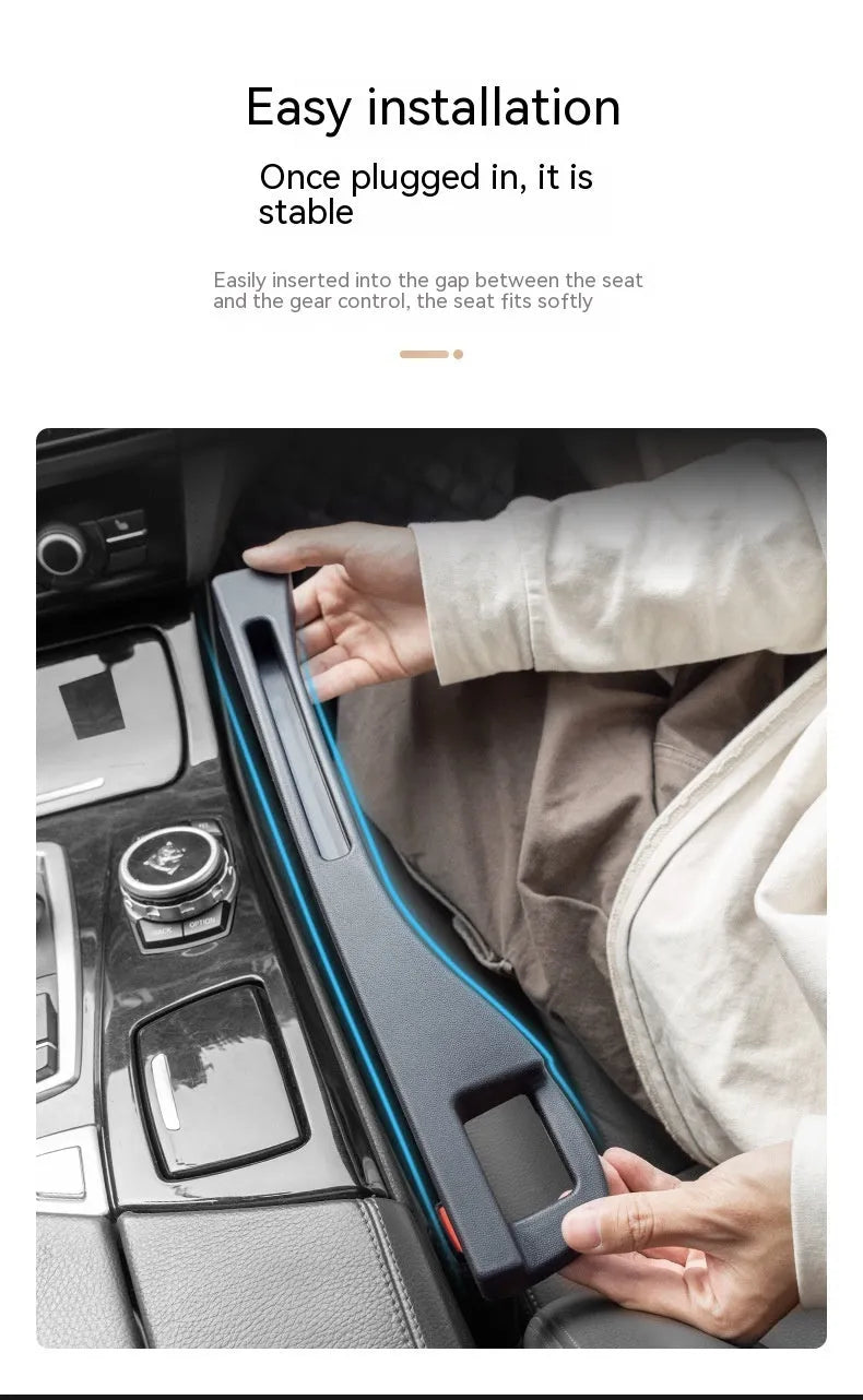 Black car gap storage box with handle positioned between car seats