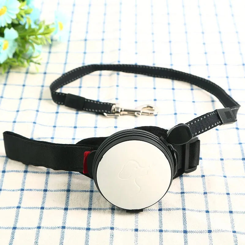 Pet Holding Hands automatic retractable dog leash extended, showing nylon cord and ergonomic handle.