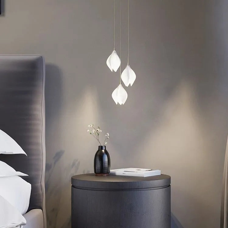 Single head ceramic magnolia flower pendant chandelier light with a minimalist design.