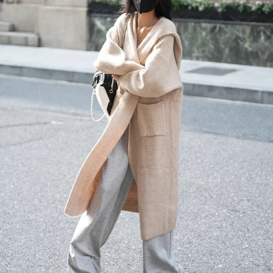 Long knitted hooded cardigan trench coat in wool blend cashmere fabric showing splicing sleeve details