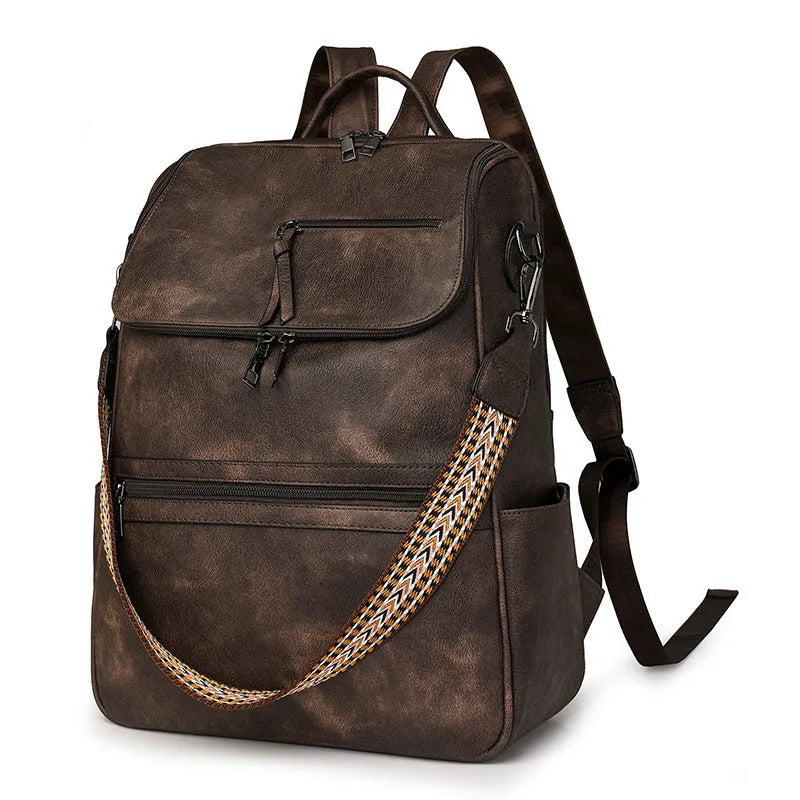 Retro college backpack in PU material with a curved shoulder strap shown in multiple colour options.