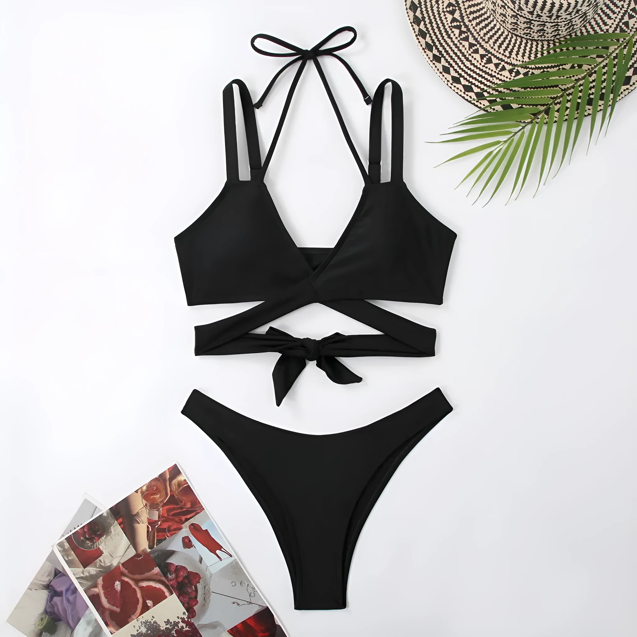 Women's solid colour strap bikini swimsuit in a brief style on a white background.