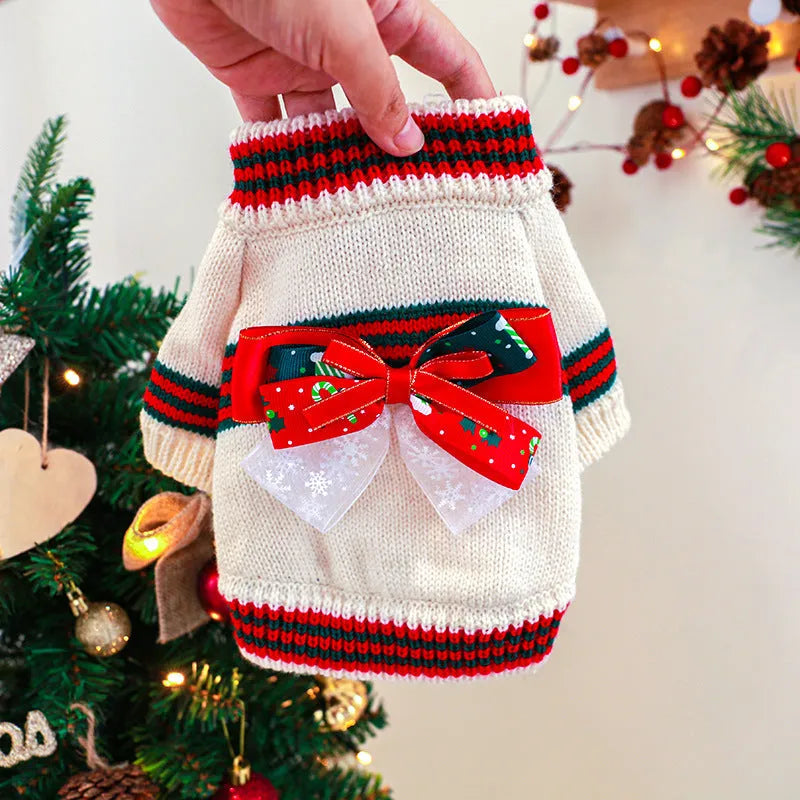 Red and green dog Christmas jumpers on a size chart showing XS, S, M, L, XL for pet weights 1kg to 9kg