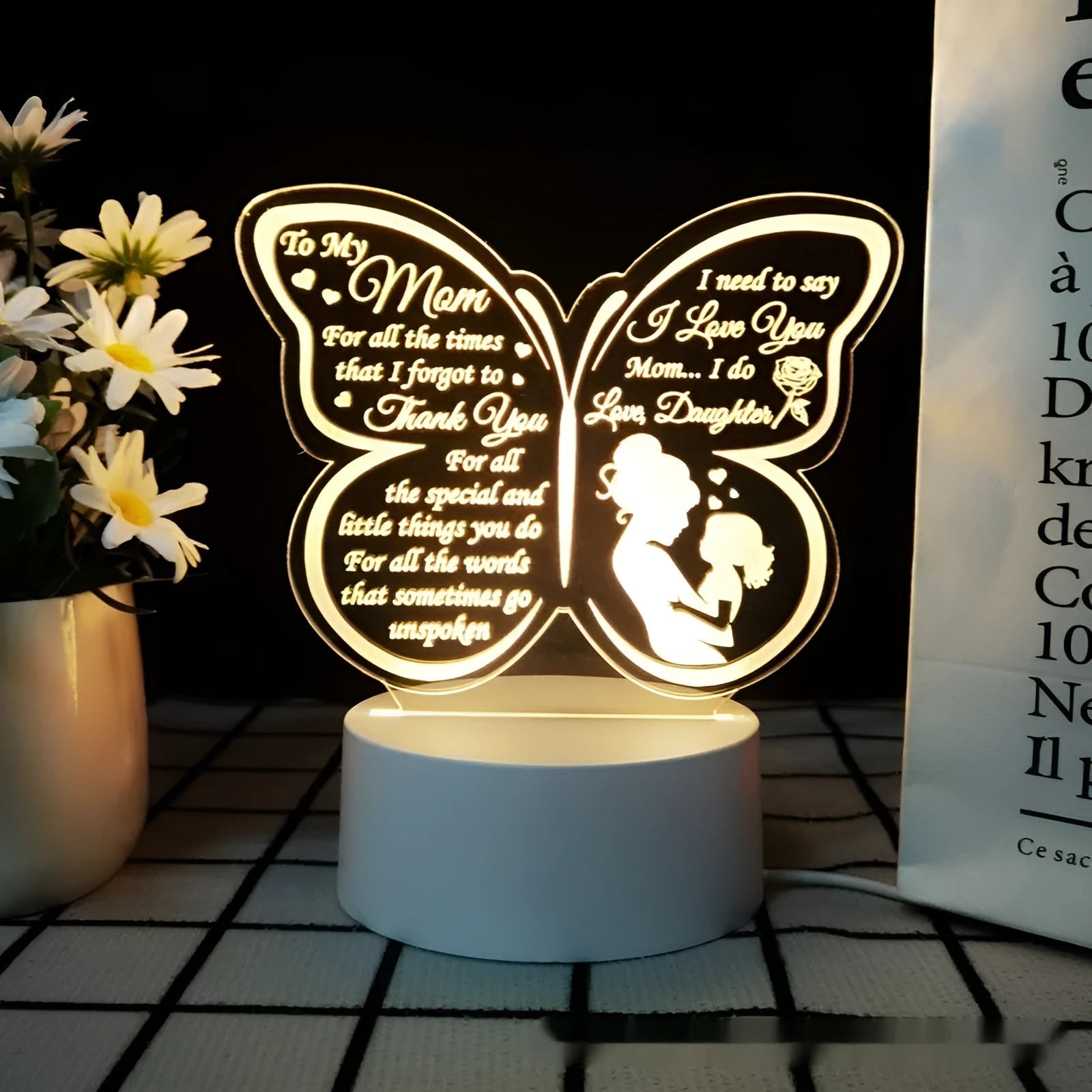 White heart-shaped table lamp with touch control and USB power cable on wooden surface