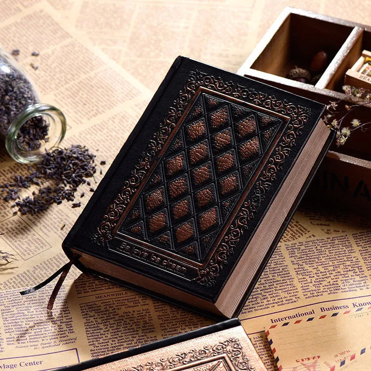 Embossed faux leather notepad in bronze colour option showing its textured cover and thick profile.