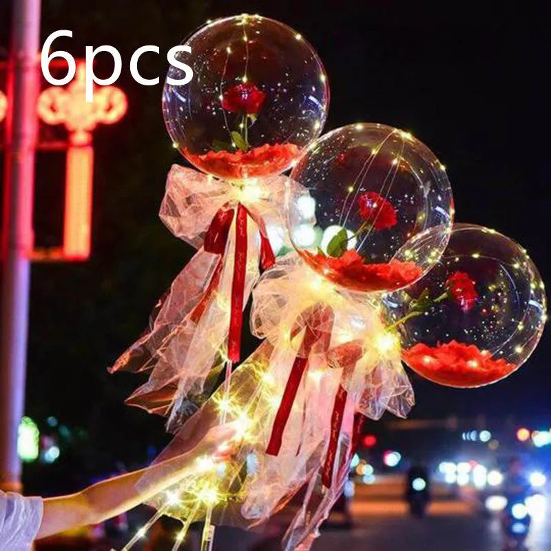 Transparent LED luminous balloon bouquet with artificial rose and glowing light inside, displayed as a DIY kit.