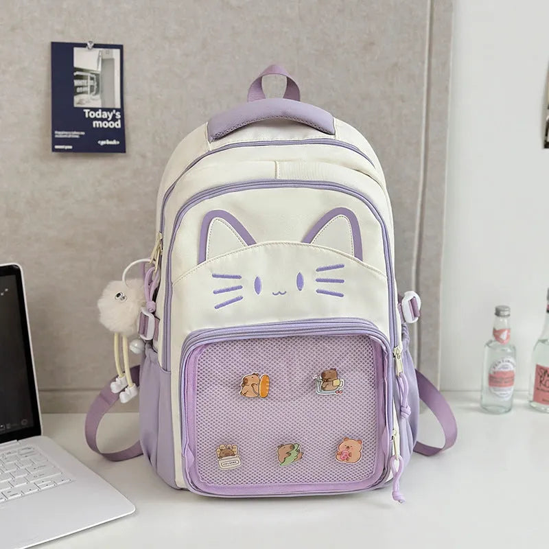 Korean cartoon large capacity nylon backpack in pink colour with badge pendant.