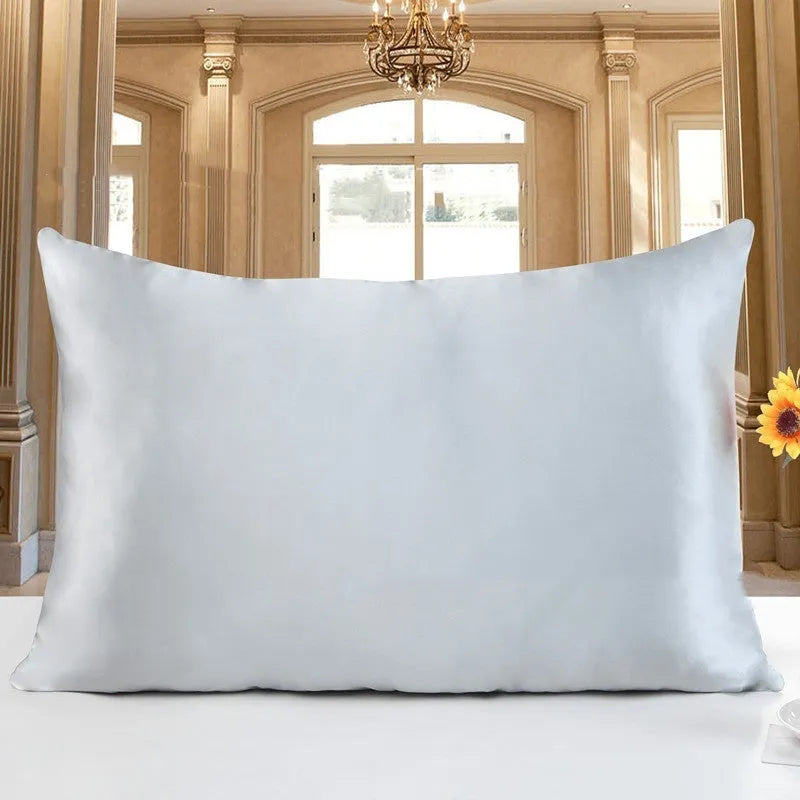 19 M double-sided silk pillowcase in apricot colour showing smooth texture and hem detail.