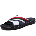 Men's cowhide leather flip-flops in white, blue, and black on a PU sole.
