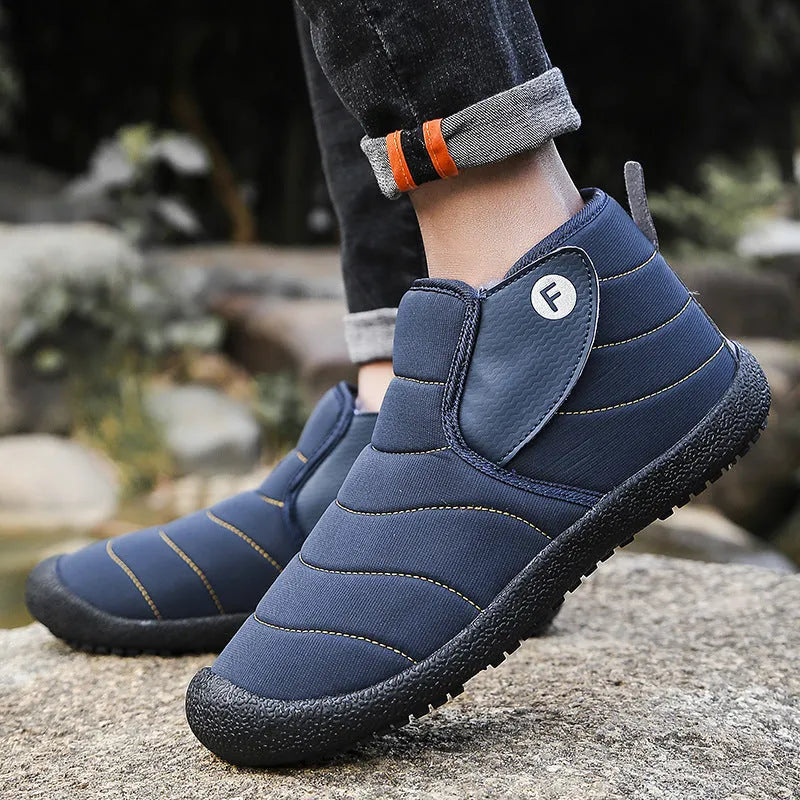 Men's waterproof snow boots in black with thick cotton upper and rubber sole.