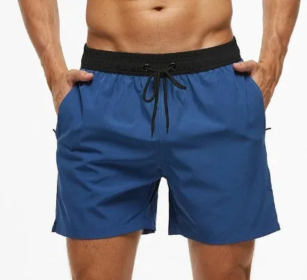 Men's blue training shorts with stitching waist detail and headband pocket for running and fitness