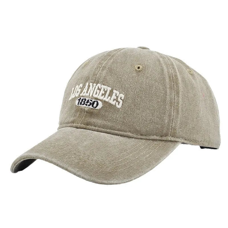 Retro adjustable peaked cap with distressed embroidery in conical crown design