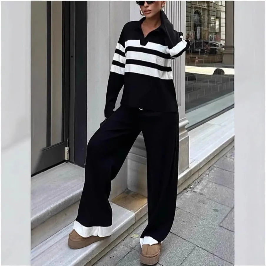 Women's black knitted two-piece set with polo collar shirt and striped matching trousers
