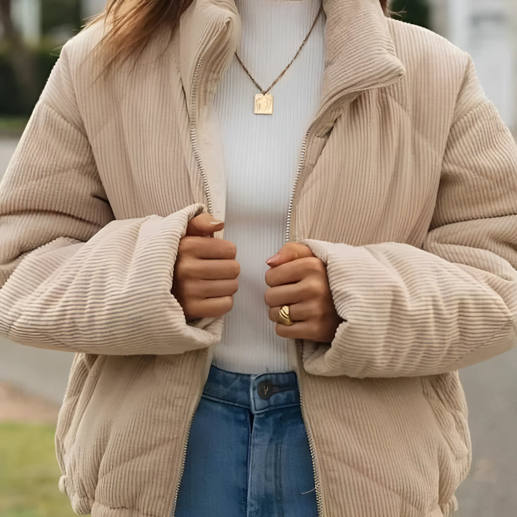 Apricot women's corduroy jacket with stand collar, long sleeves, and front zipper.