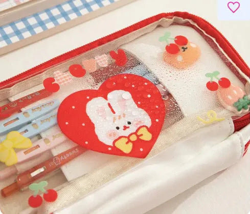 Transparent TPU pencil case with decorative rabbit designs in pink and red colour options