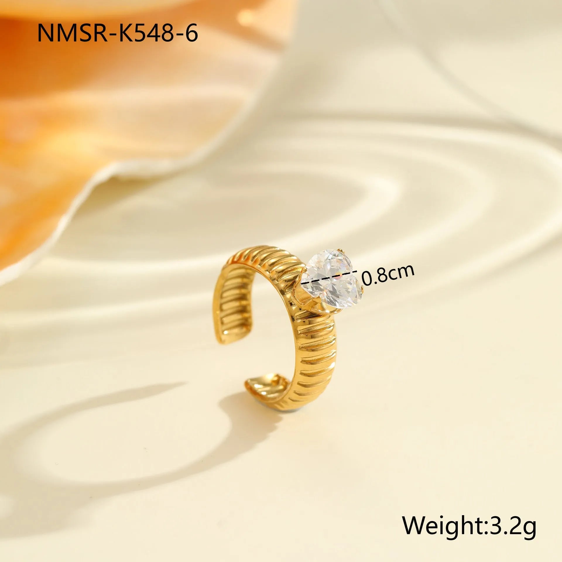 Gold electroplated stainless steel ring with zircon geometric design and open mouth adjustable fit