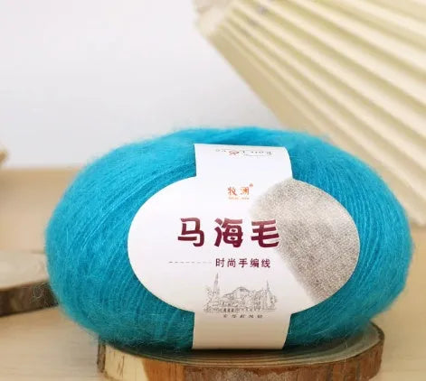 Single ball of mohair yarn in various colours for hand-woven DIY scarf knitting projects