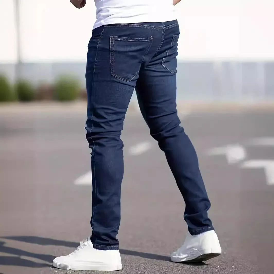 Men's dark blue slim fit casual jeans with skinny leg opening and mid waist