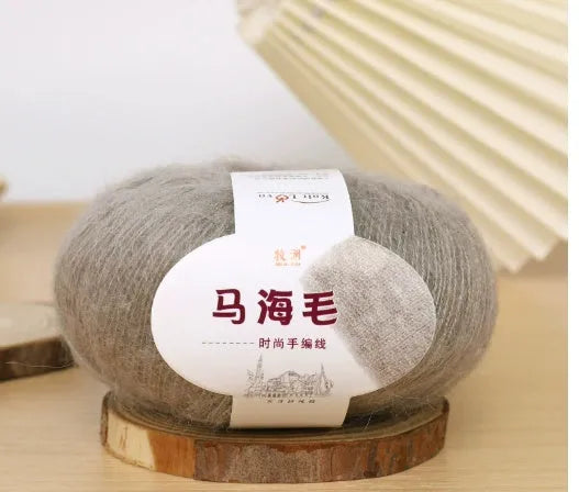 Single ball of mohair yarn in various colours for hand-woven DIY scarf knitting projects