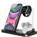 Folding 4-in-1 wireless charger in space grey colour, shown upright as a phone stand with an iPhone charging.