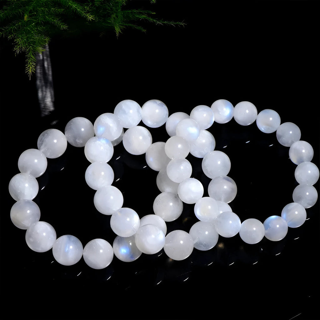 Blue moonlight polished moonstone bead bracelet with round beads in geometric arrangement