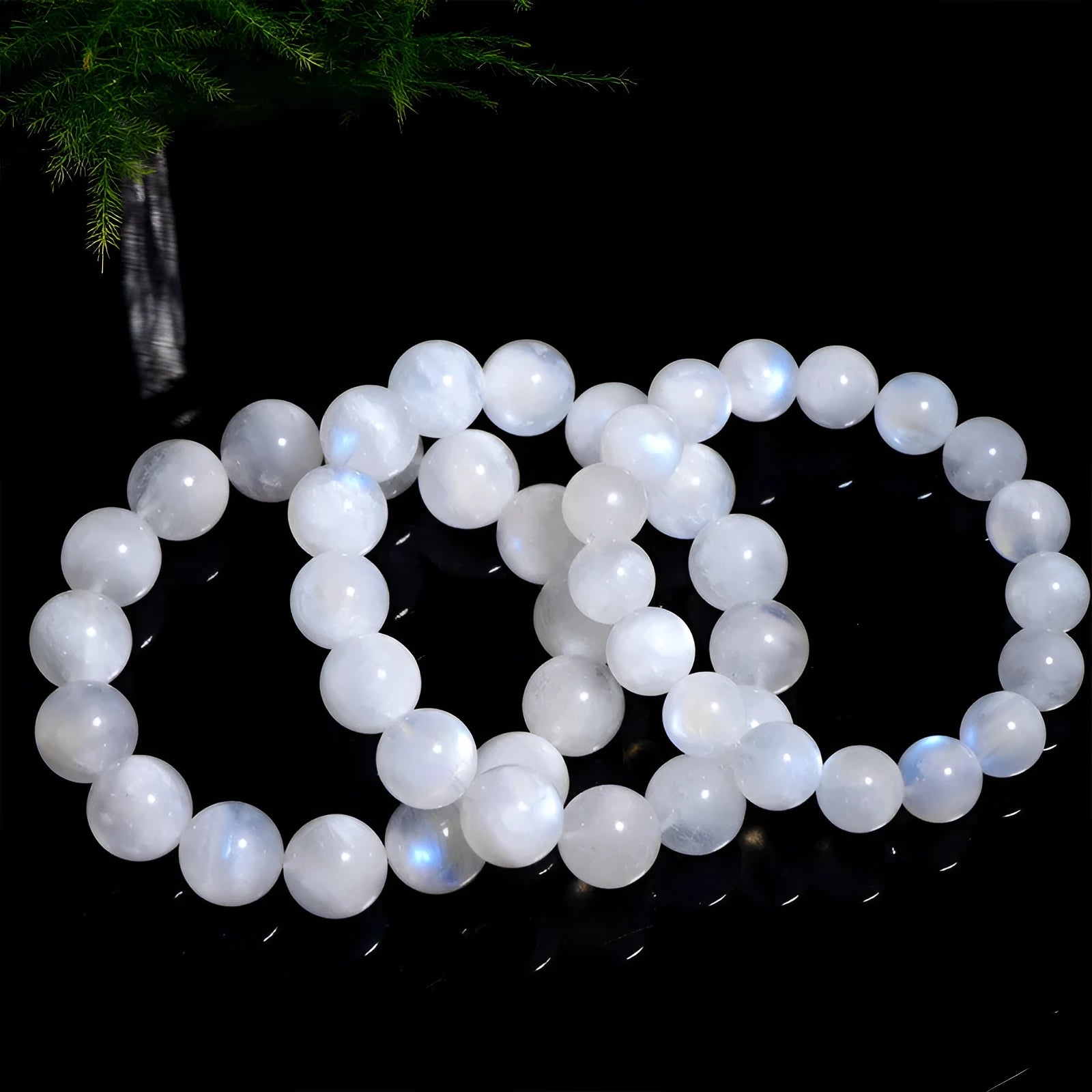 Blue moonlight polished moonstone bead bracelet with round beads in geometric arrangement