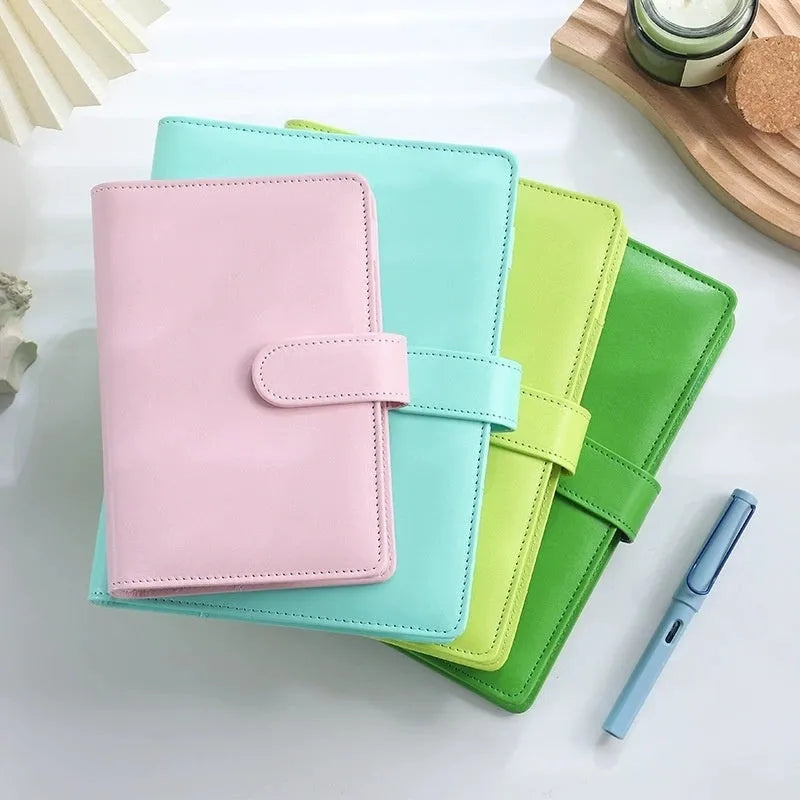 A5 PU leather zippered notebook shell in multiple solid colours including pink, blue, and black.