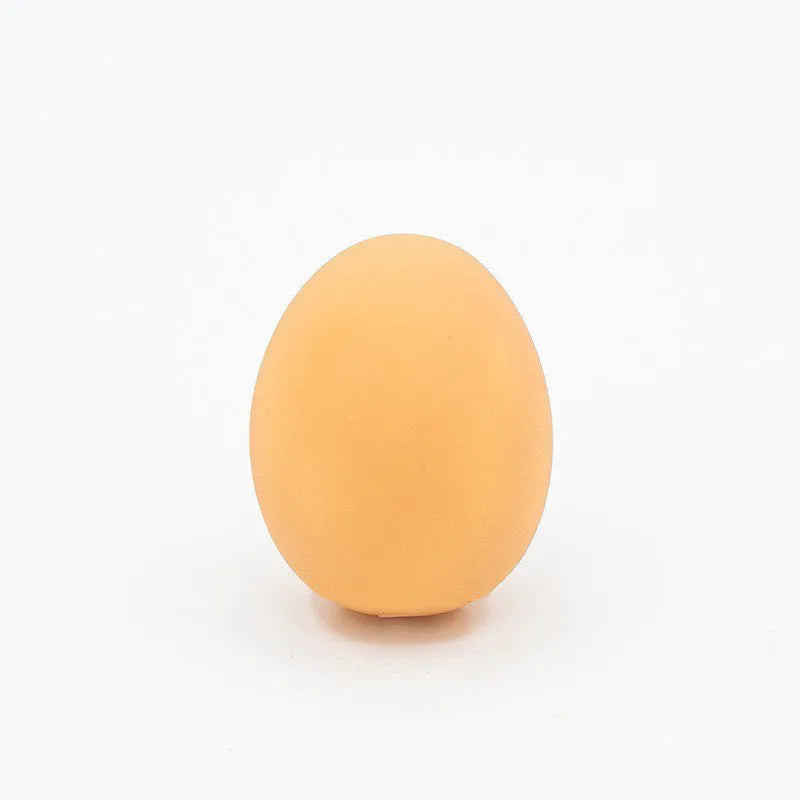 Bright coloured rubber egg-shaped dog toy with textured surface for dental cleaning