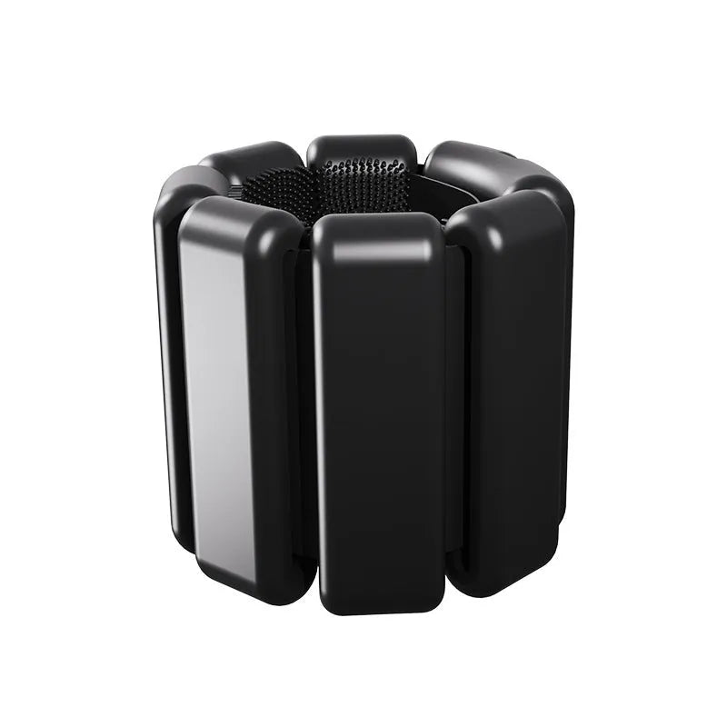 A black silicone weight-bearing bracelet with Velcro fastening, shown with 1lb and 2lb weight options.