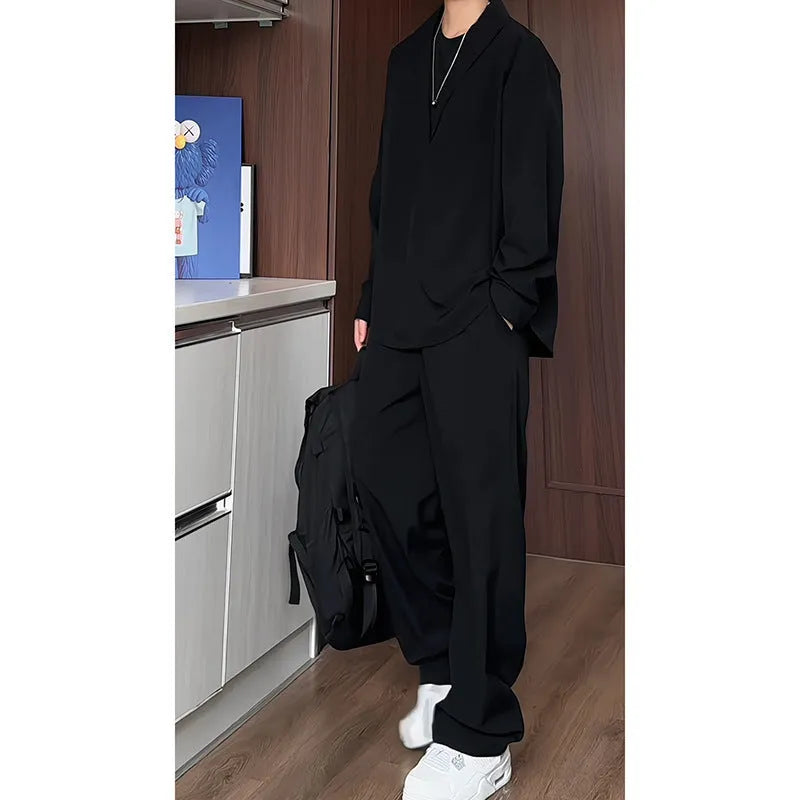 Men's black slim fit polo shirt and trousers two-piece casual suit on a hanger.