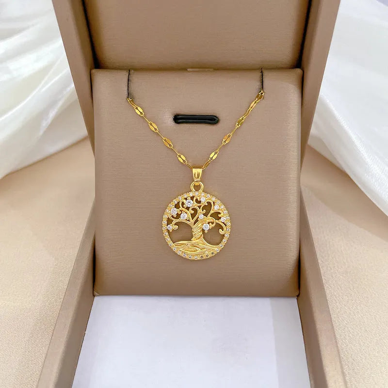 Gold plated Lucky Tree Light necklace with rhinestone details and a Mother Pearl pendant on an adjustable chain.