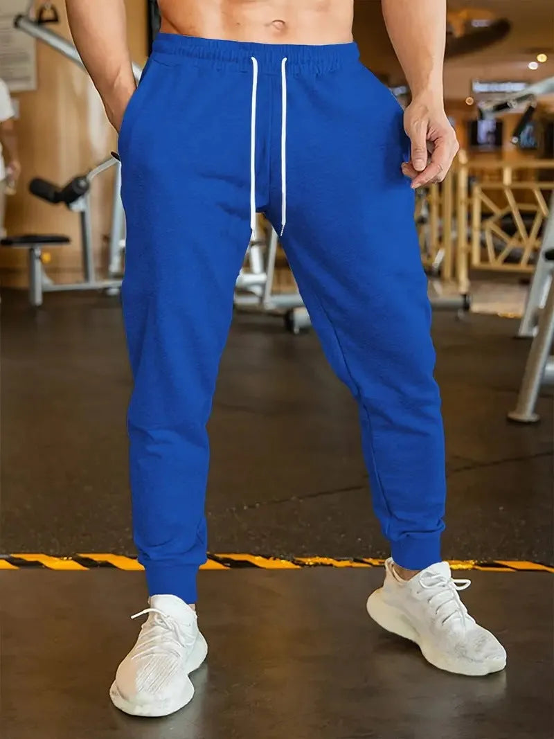 Men's loose-fit linen style leisure trousers with an elastic drawstring waist.