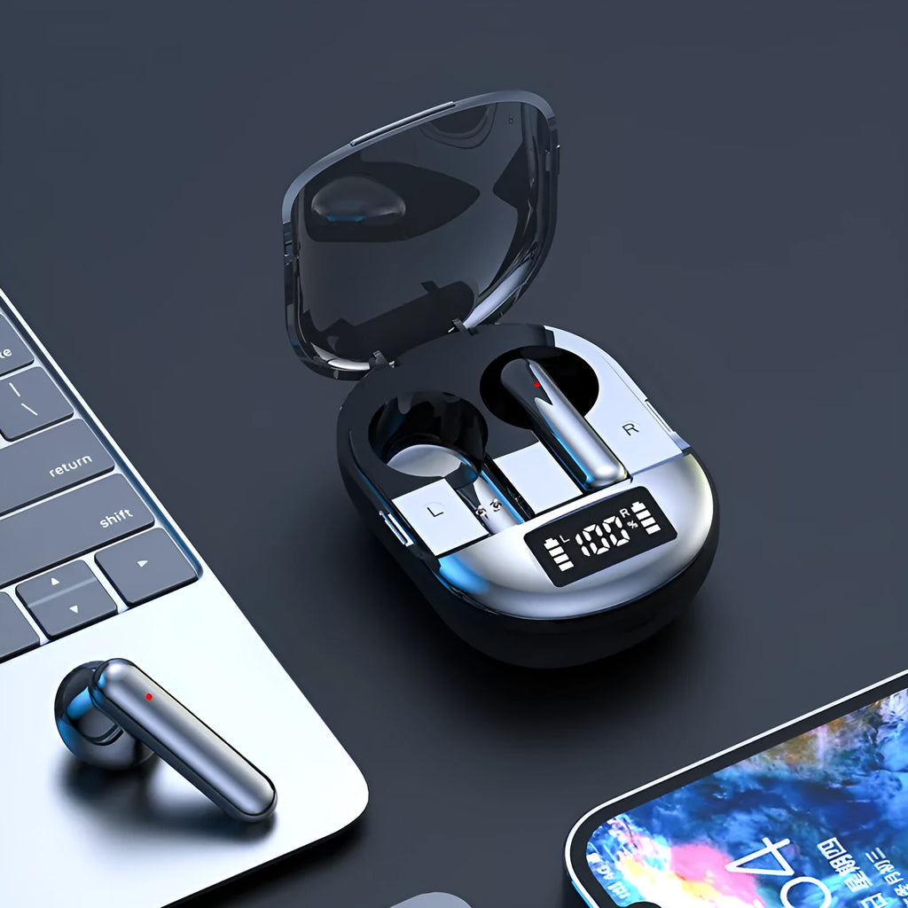 Black and white wireless Bluetooth in-ear headphones with a charging bin on a table.