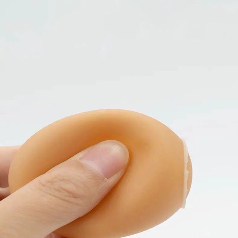 Bright coloured rubber egg-shaped dog toy with textured surface for dental cleaning