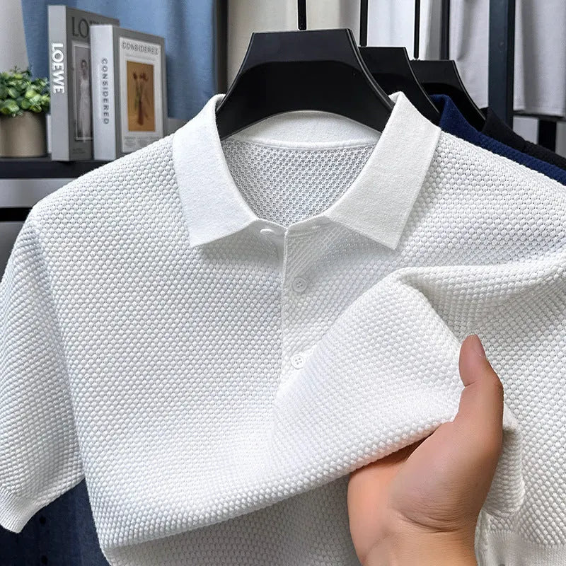 Loose fitting short sleeve cotton sweater in a neutral colour, showing pullover style and casual fit.