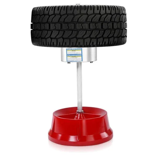 Portable aluminium hub tyre balancer with bull's eye level on enamel base.