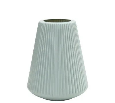 Melamine plastic decorative flower vase in blue colour on desktop
