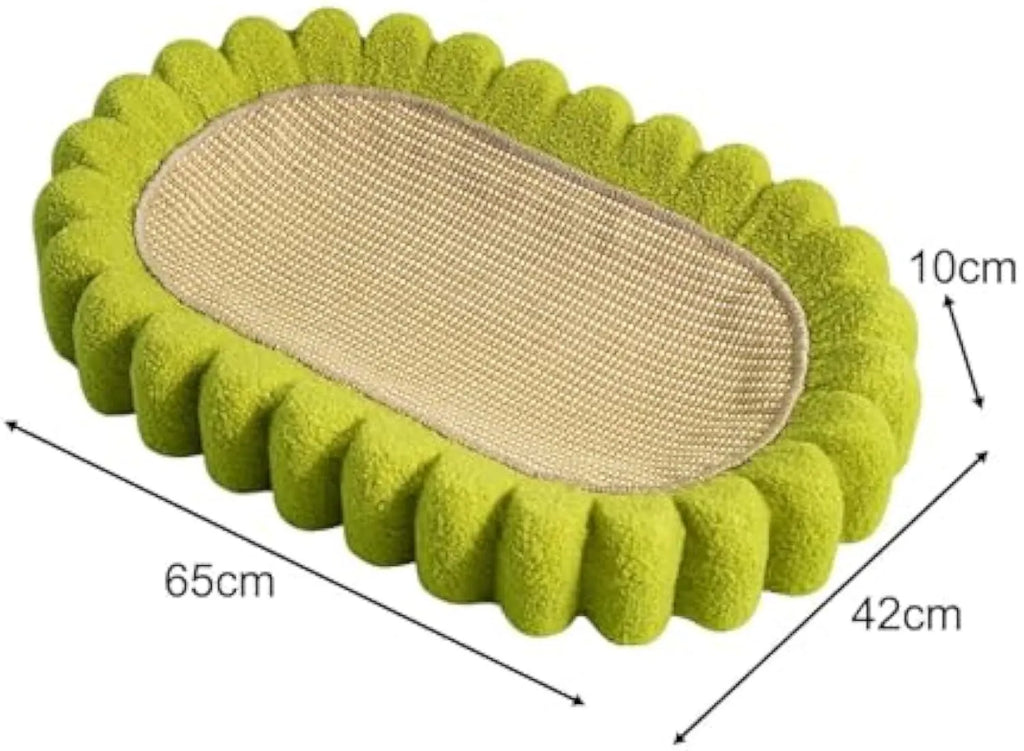 Green oval sisal cat scratching pad serving as a lounging bed, dimensions 650mm by 420mm.