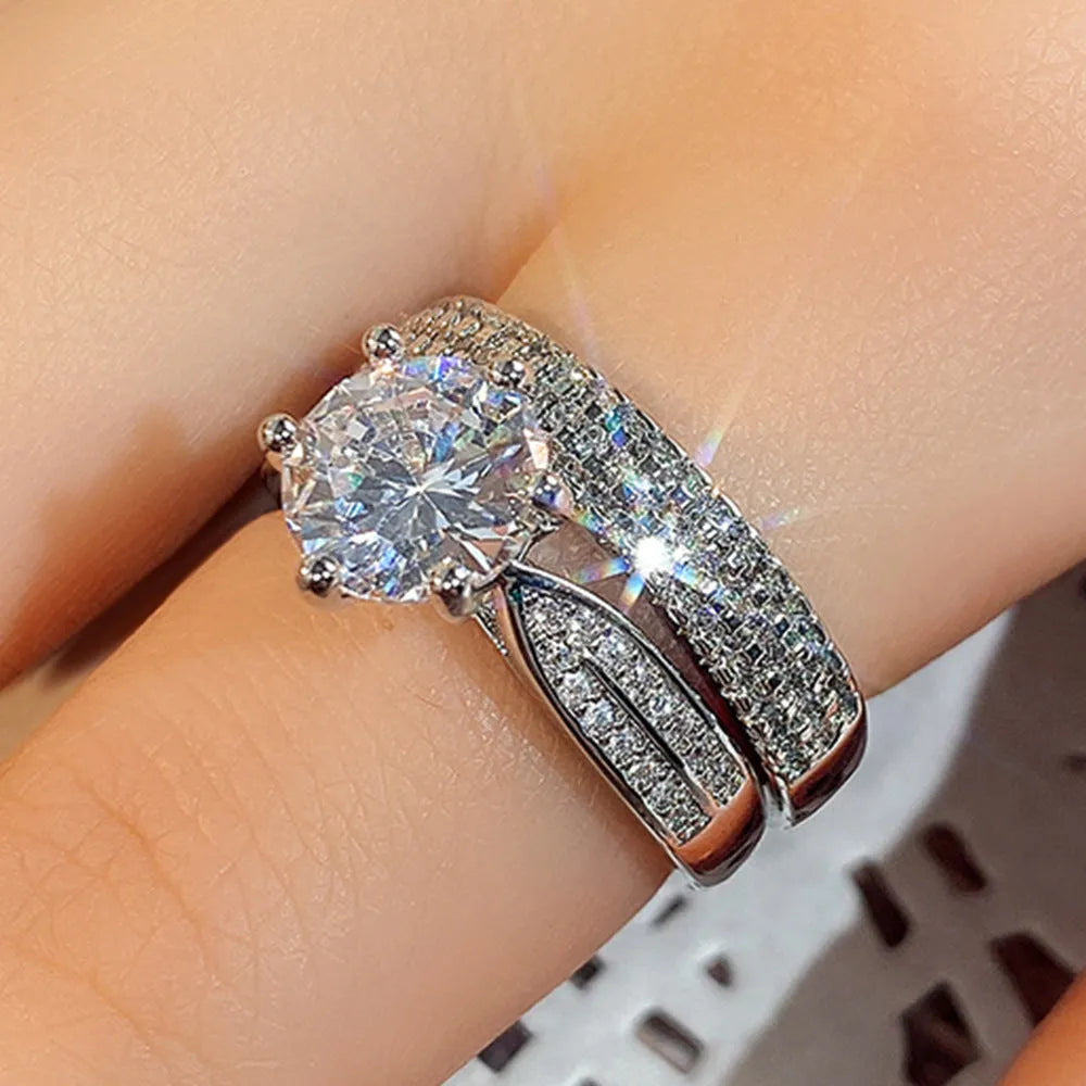 White gold colour geometric wedding combined ring bracelet with round details on a hand.
