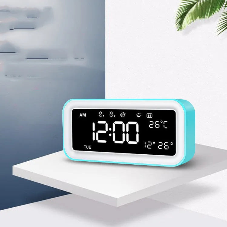 Rectangular LED digital alarm clock with multicolour ambient lighting and quartz glass display in blue colour