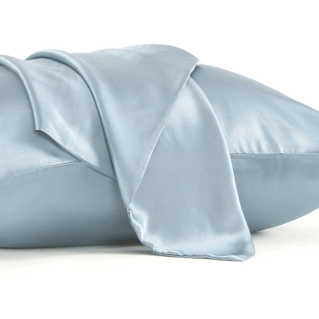 Dark grey silk pillowcase with envelope closure, shown flat and on a pillow.
