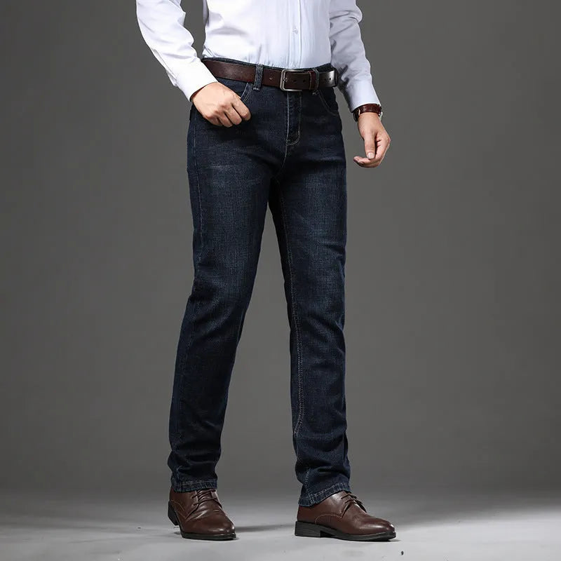 Men's black straight-leg stretch jeans with mid-waist and zip closure on plus size model