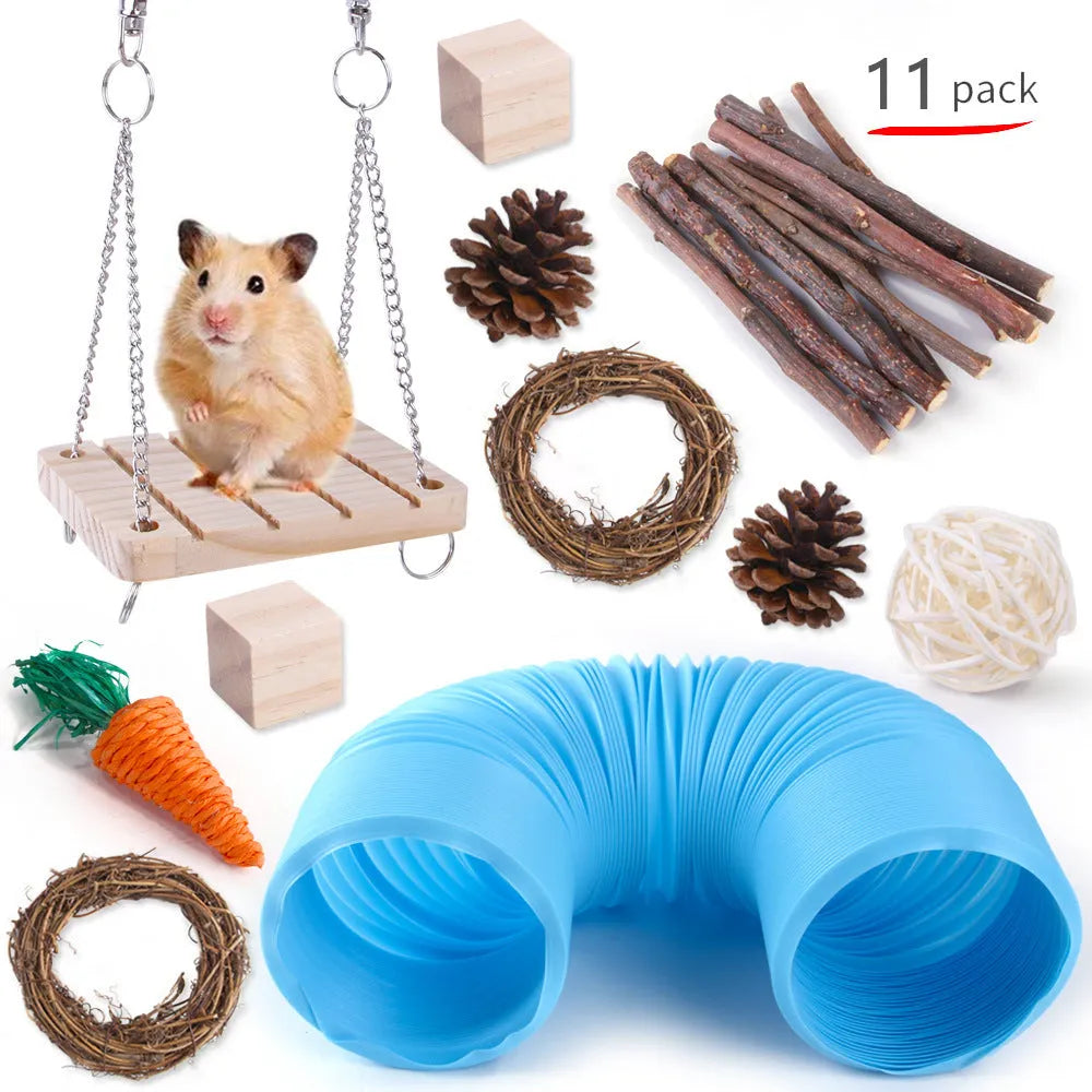 Assortment of wooden and natural fibre chewing toys for pet rabbits, guinea pigs, and parrots on a straw mat