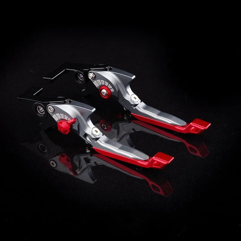 Pair of anodised metal motorcycle brake and clutch levers with adjustable length mechanism