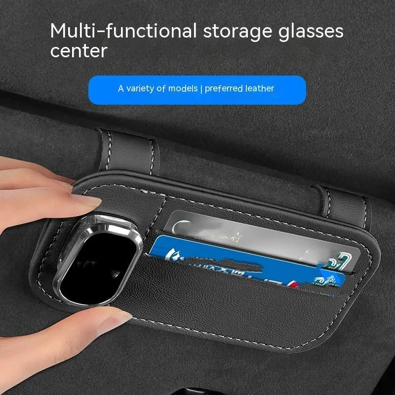 Beige leather car sun visor card holder with a glasses clip shown installed on a vehicle visor.