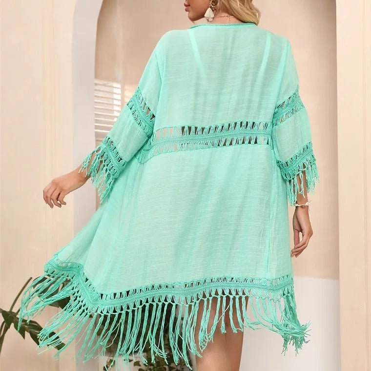 Hand-crocheted acrylic beach cover-up cardigan with tassel detailing in solid colour