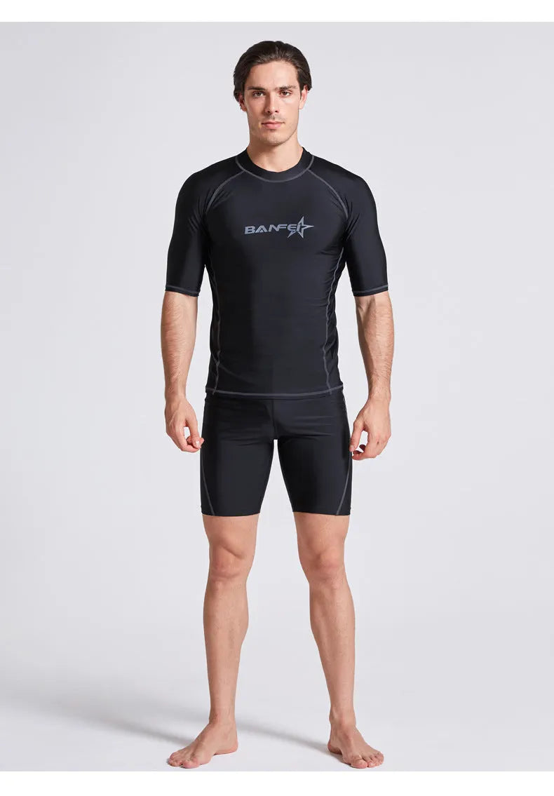 Men's quick-drying half sleeve swim suit with separate swim top and pants in navy blue.