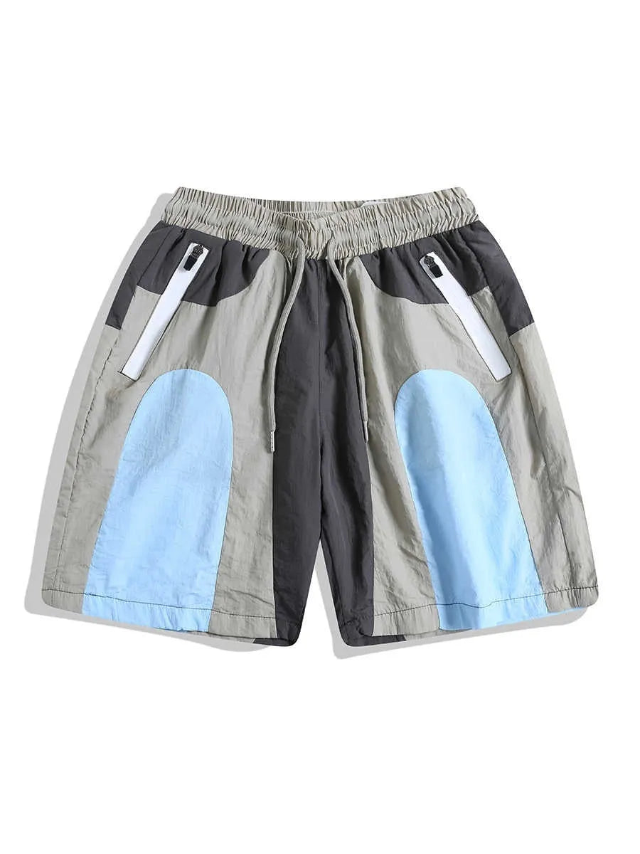Blue patchwork outdoor sports shorts with loose straight-leg design and quick-drying fabric
